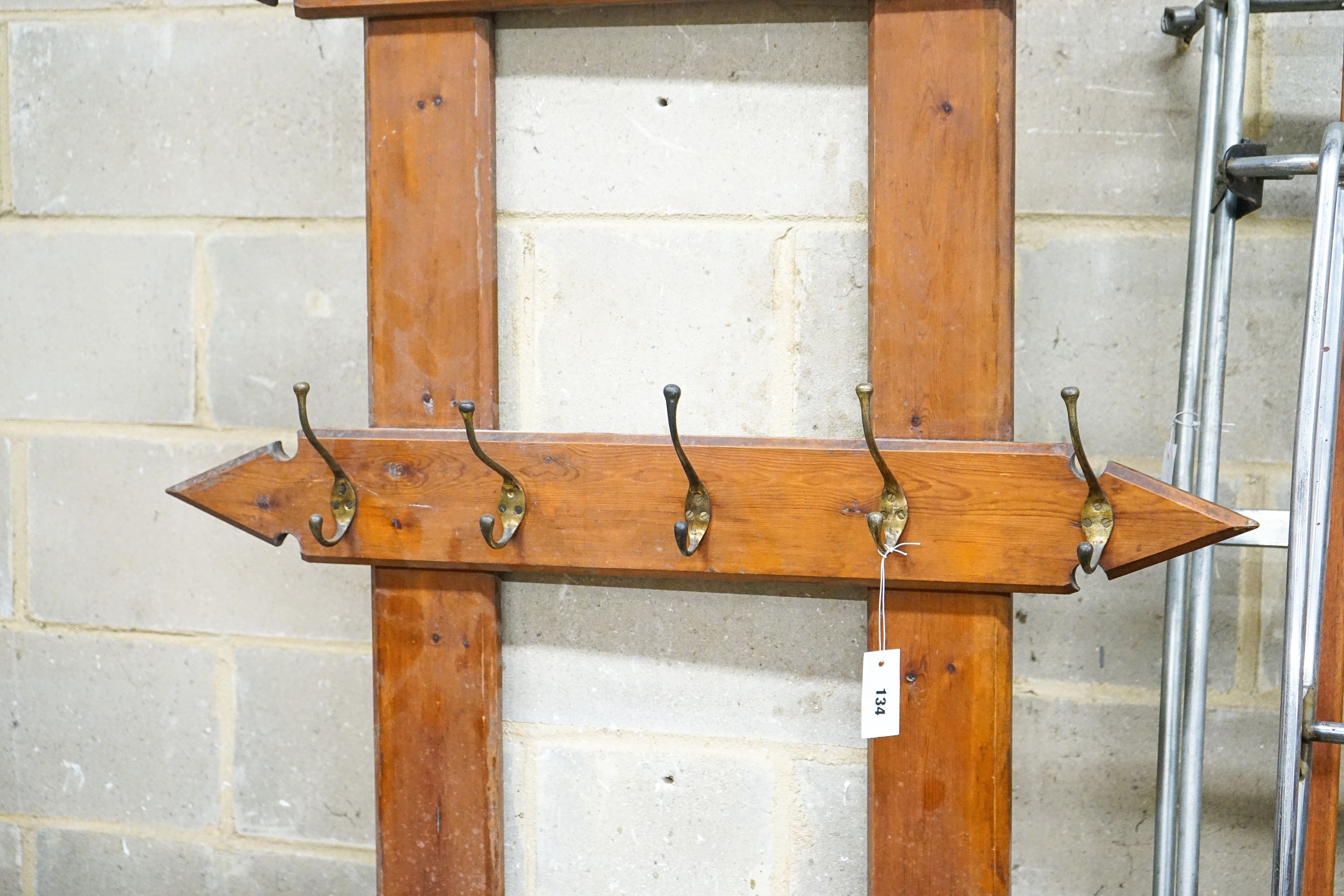 A late Victorian pitch pine hall stand, width 96cm, height 212cm